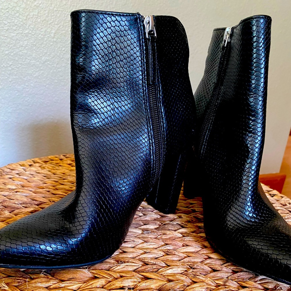 Black faux snake skin fashion bootie. 3” heel. Inside zipper. Women’s size 7.